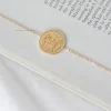 Bijoux^Outfitbook Bracelet doré avec pendentif pièce dore